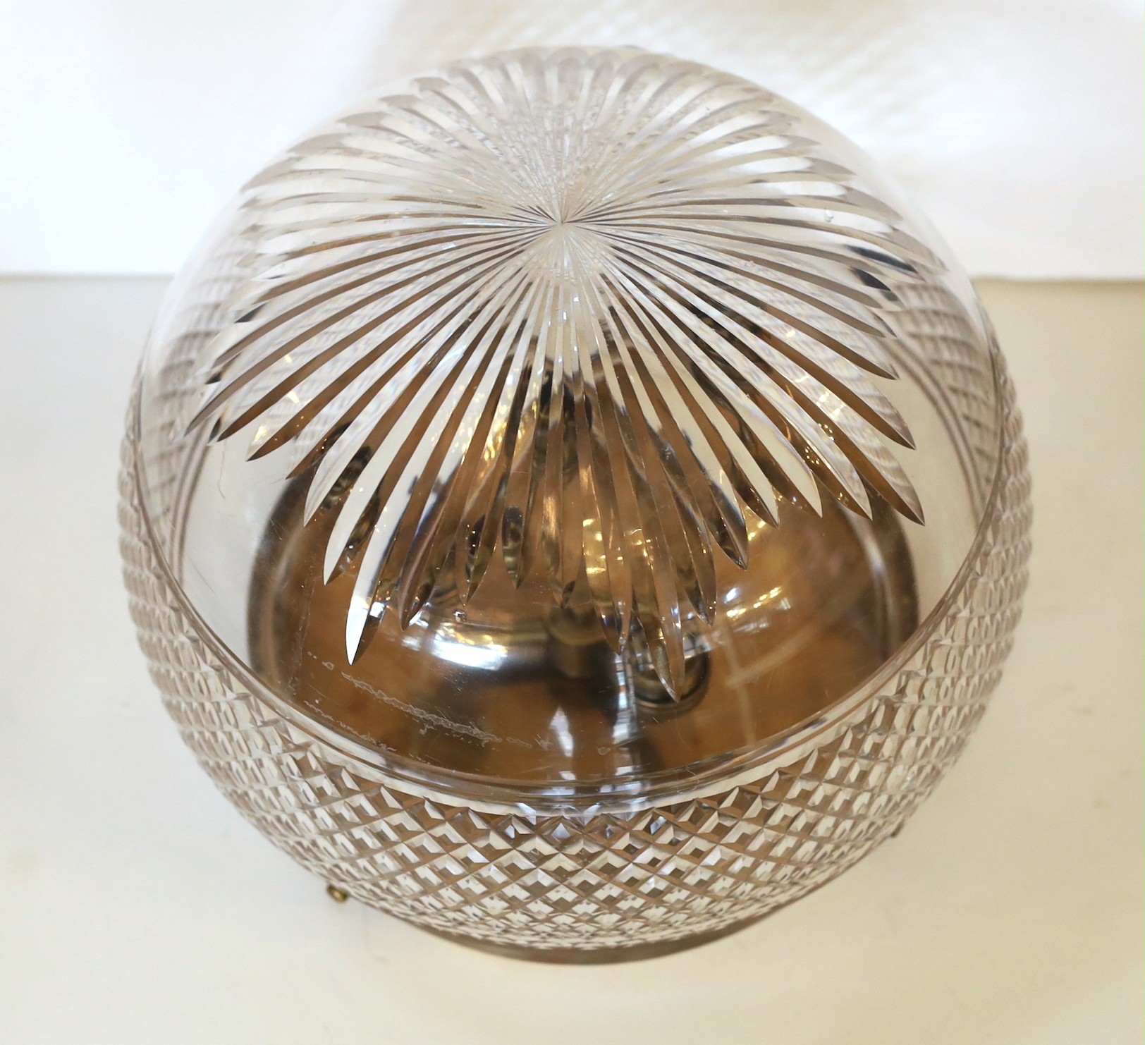 An Edwardian style cut glass light bowl with bronze three light mount, height 24cm. width 28cm